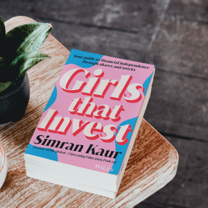 Image of book called Girls that invest on a coffee table
